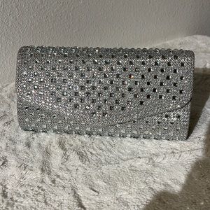 Silver fancy clutch with bling, chain for crossbody wear available.